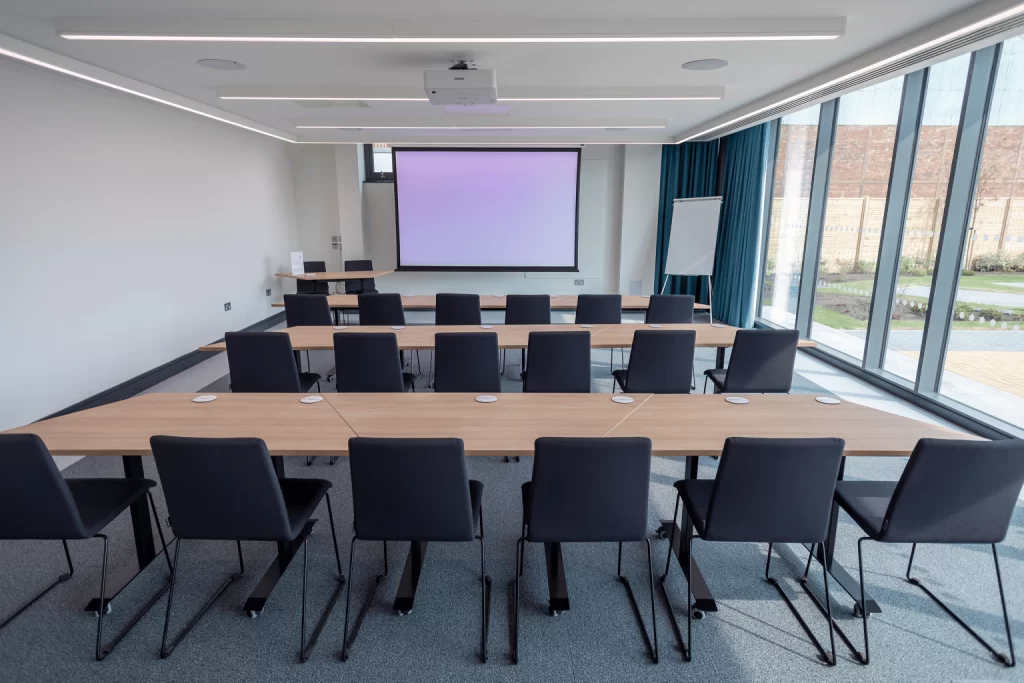 Conference room with chairs facing screen